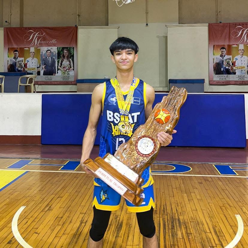 Gab Bosch with award and medals